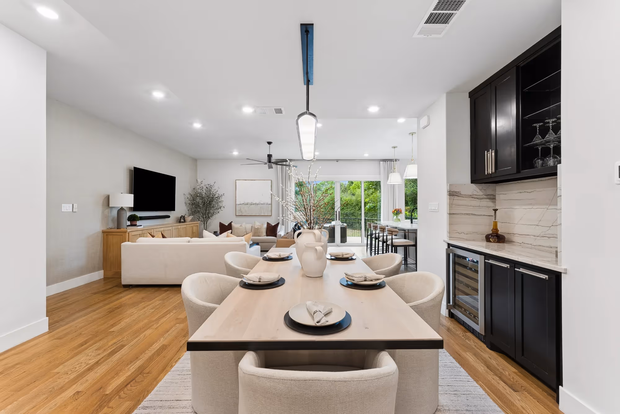 Open-plan living room with dining table and modern kitchen