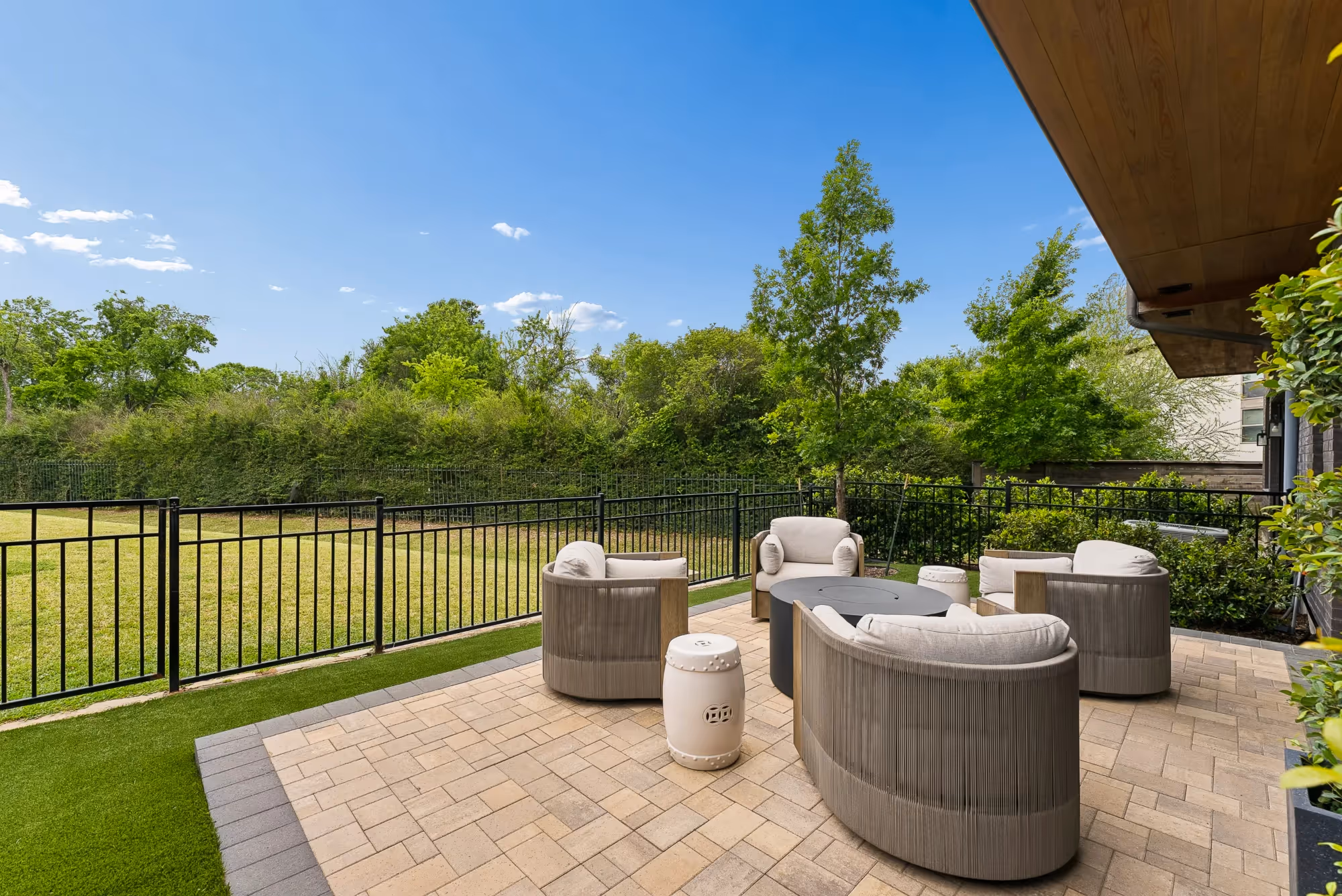 Patio seating area with view of green fields