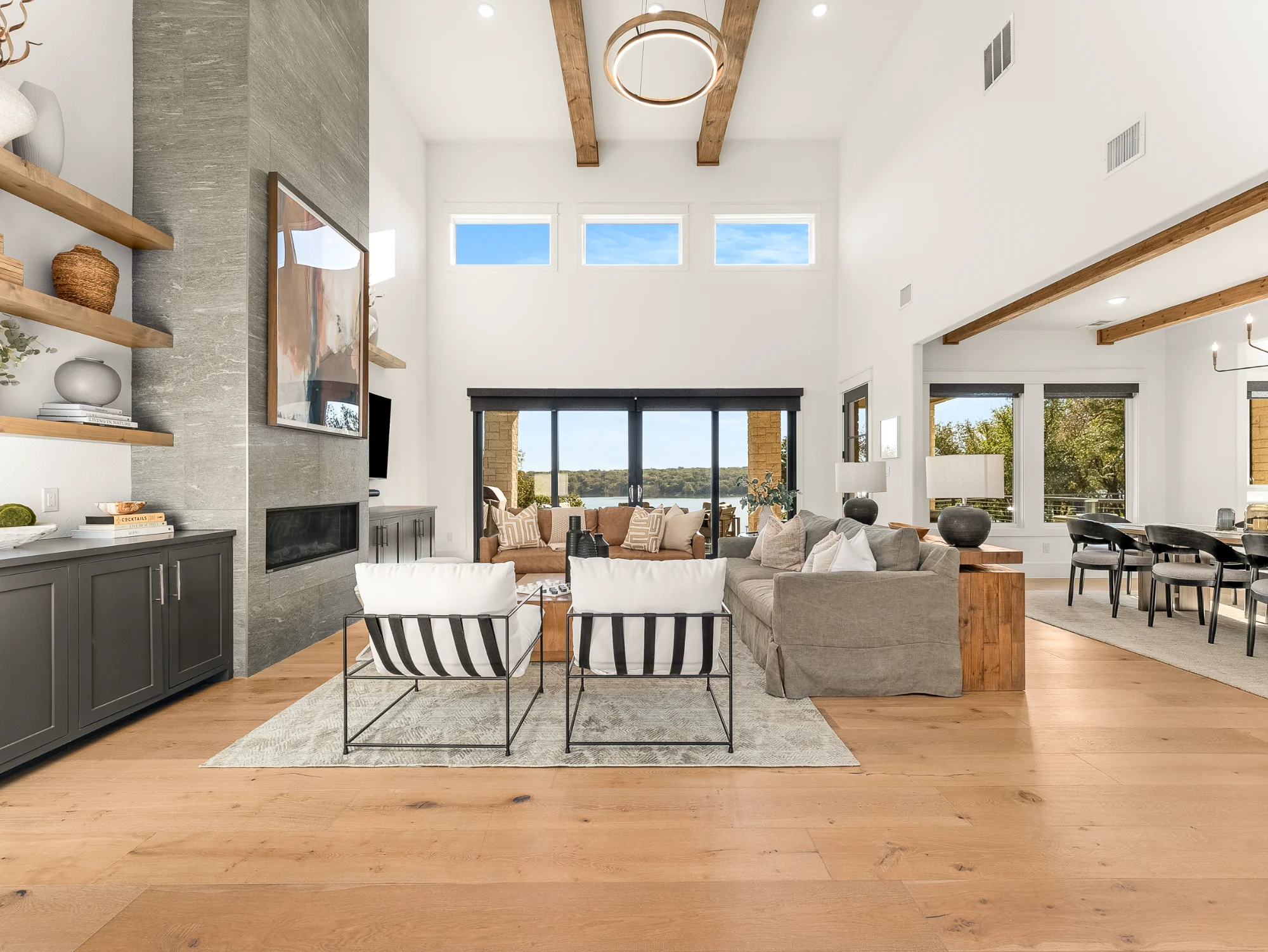 Open-concept living room and kitchen with high ceilings