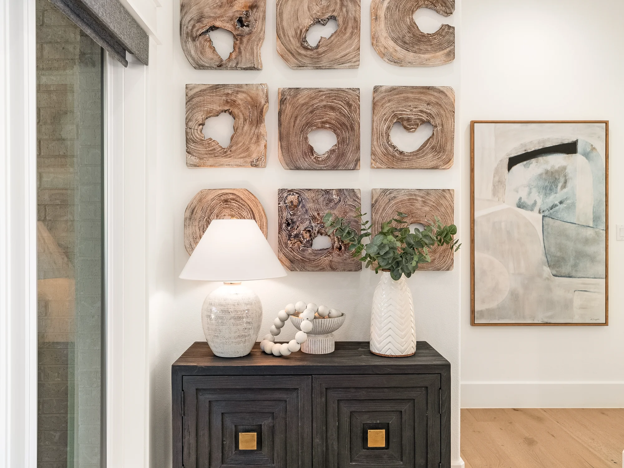 Entryway console table with wall art and decor