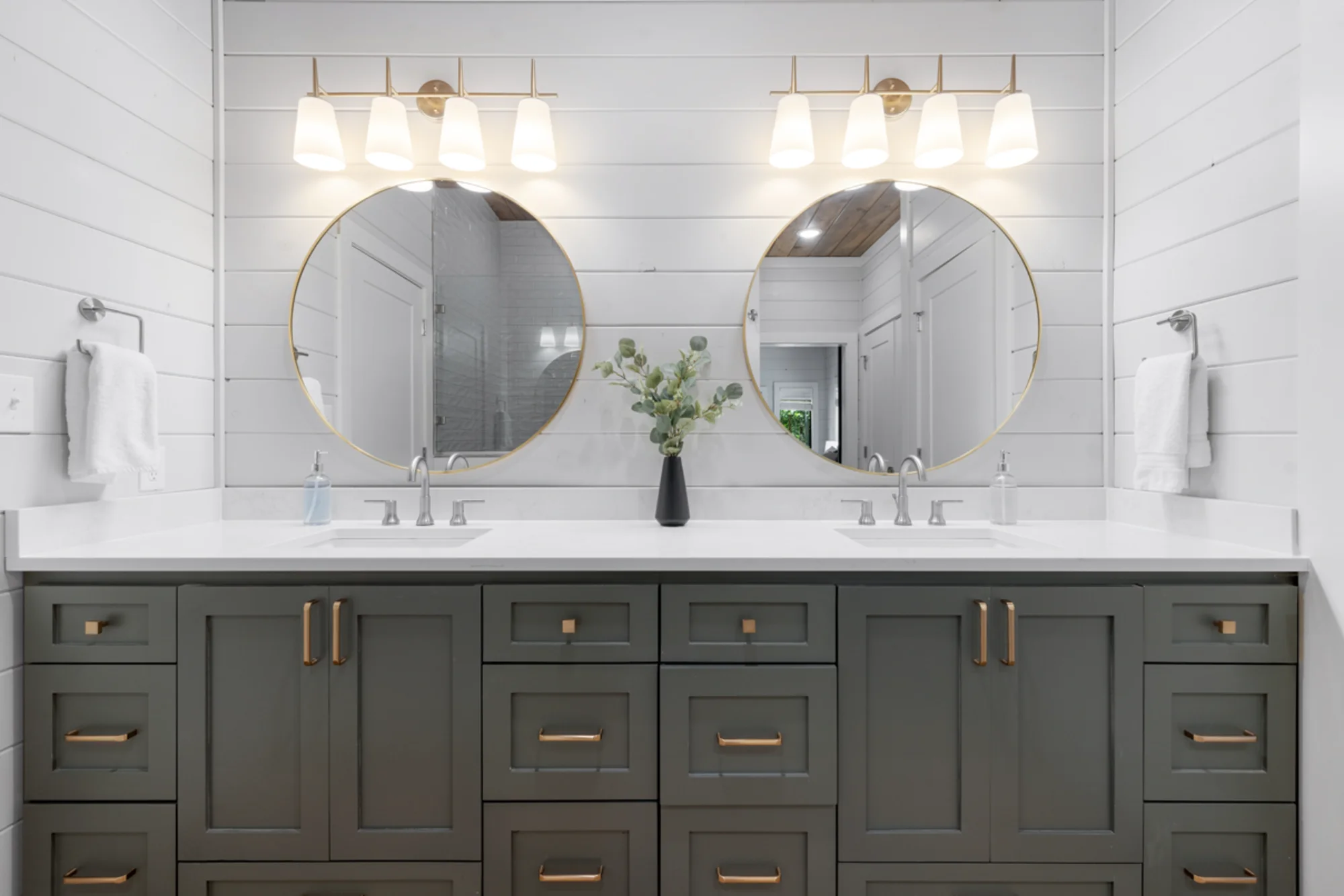 Double vanity bathroom with two round mirrors