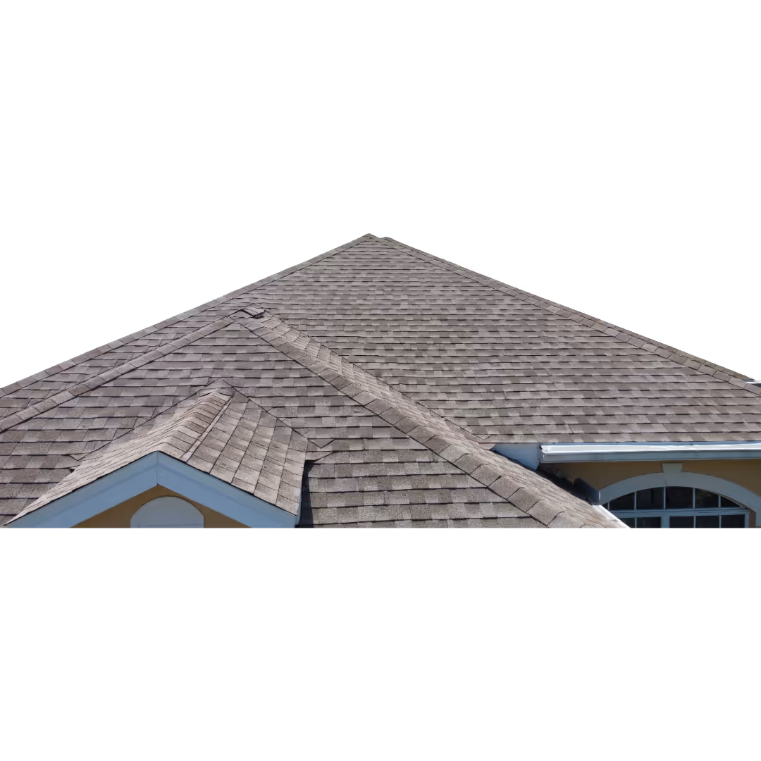 Gray asphalt shingle roof of a house with multiple slopes and ridge lines.