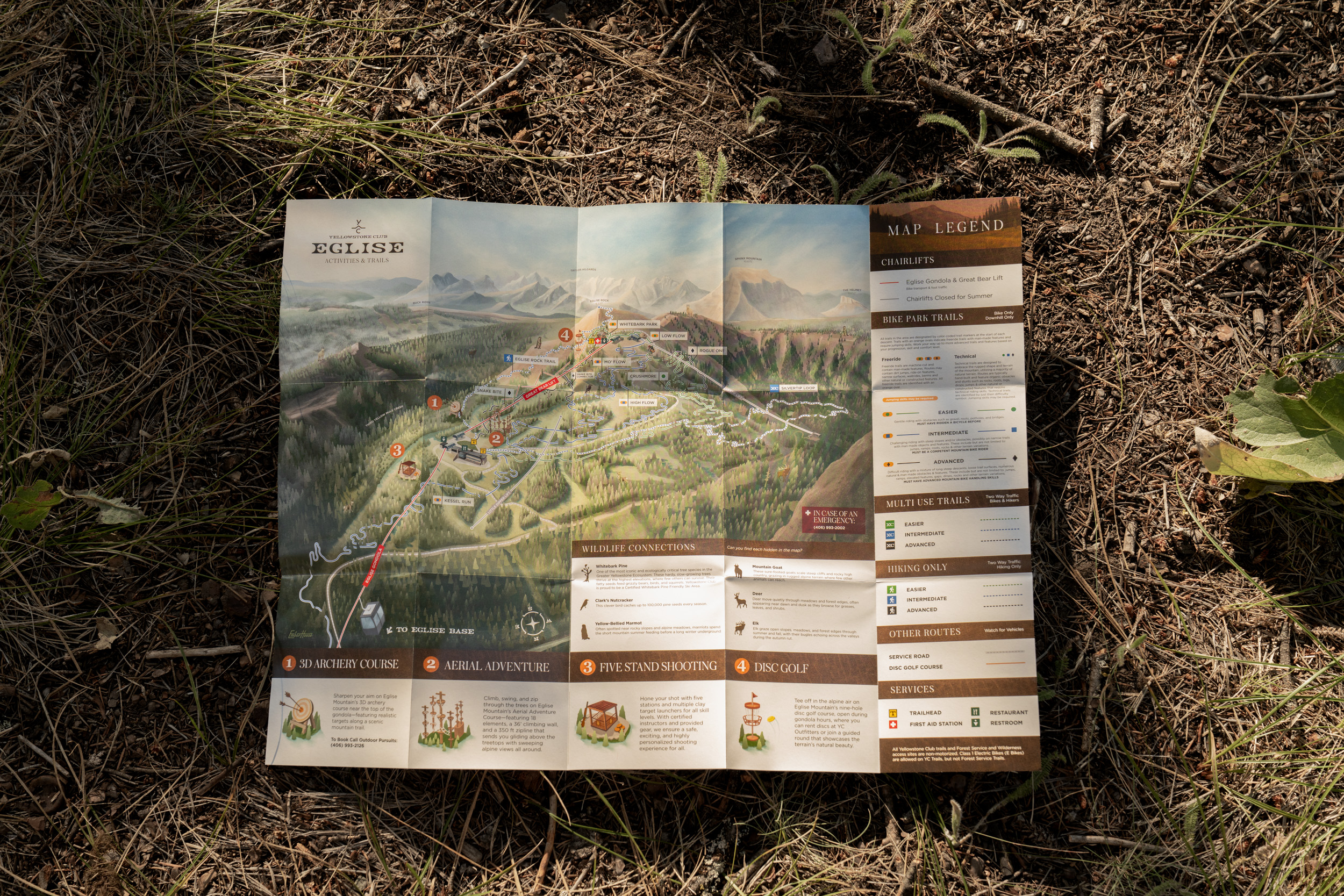 The printed Eglise Mountain map unfolded on the forest floor