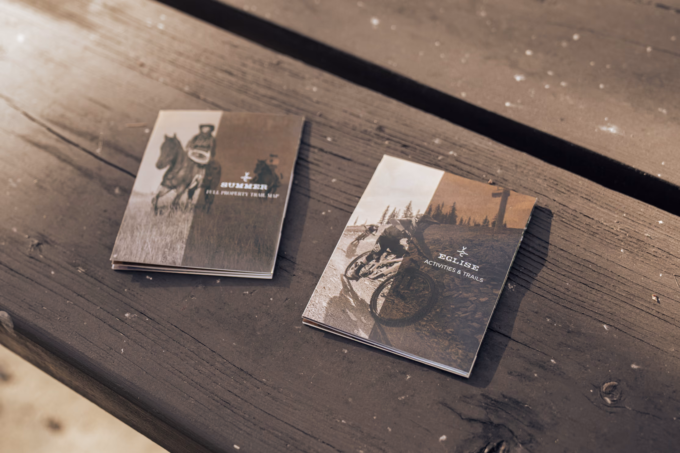 The folded Summer and Eglise map covers resting on a bench