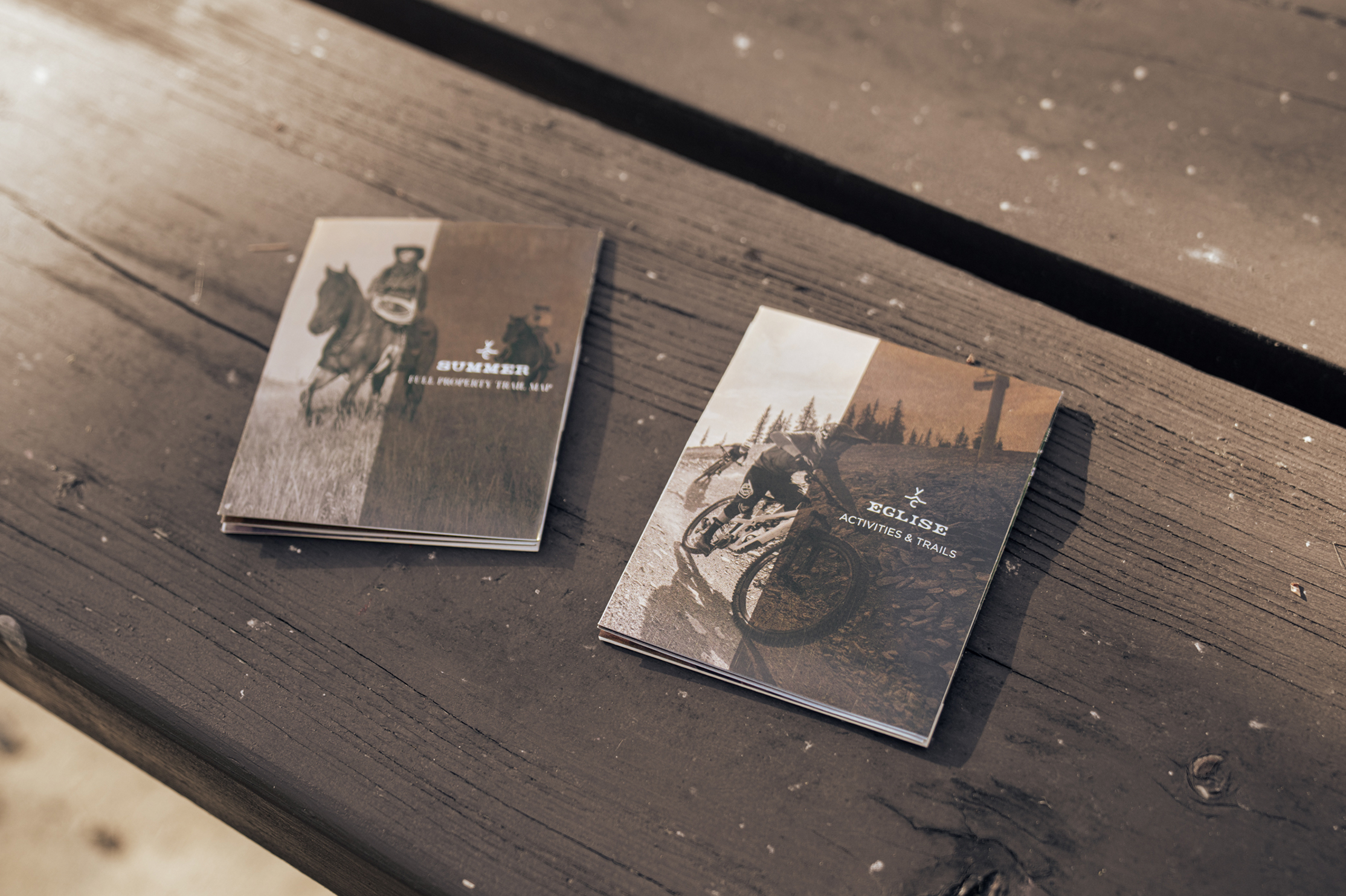 The folded Summer and Eglise map covers resting on a bench