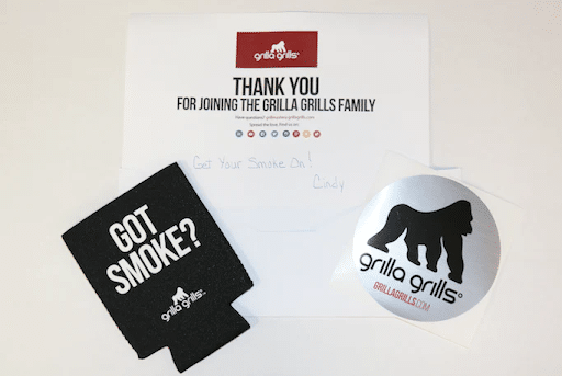 Grilla Grillz product insert includes a sticker and drink coozie.