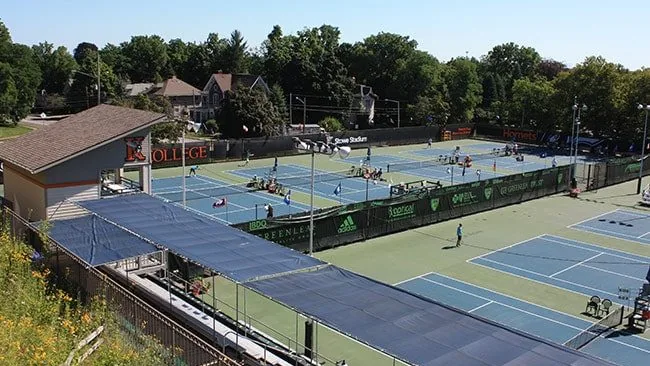 Elevated view of players competing on the blue courts of Stowe Stadium at the junior nationals in Kalamazoo