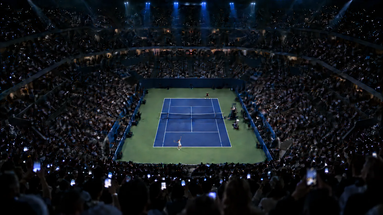 Packed night session in a tennis stadium