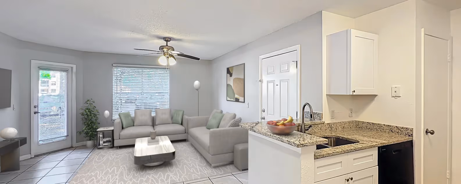 Virtually staged living area with view of kitchen with white cabinets and black dishwasher