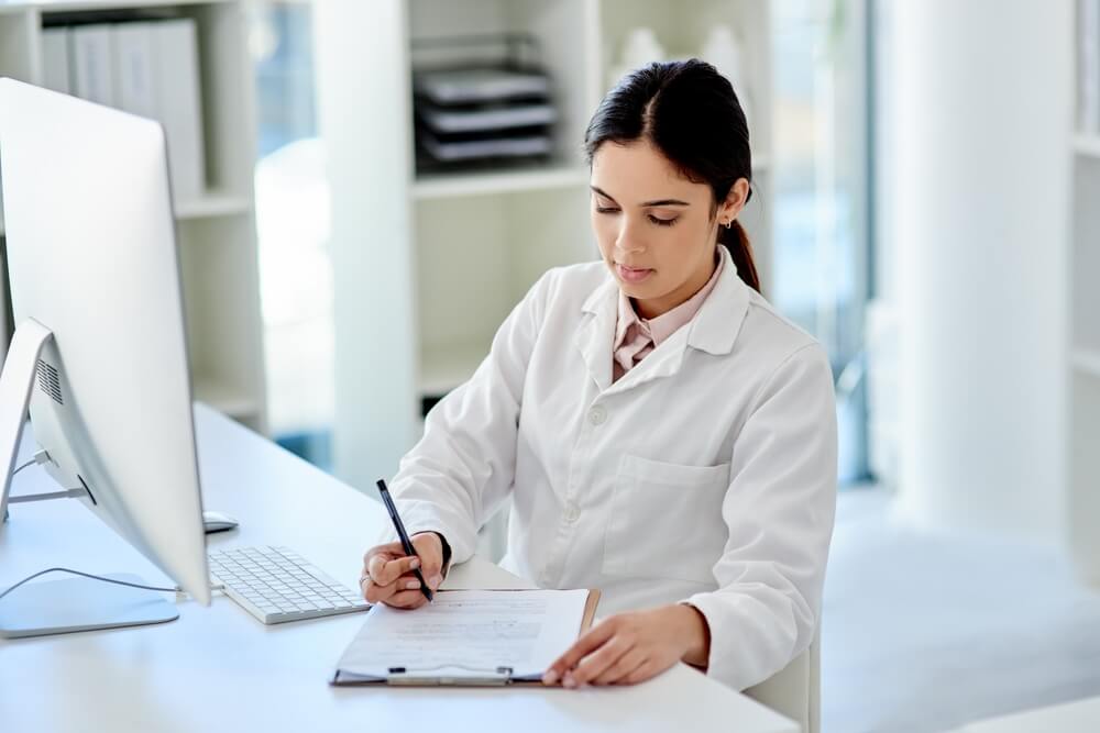 Science, computer and woman with checklist, clipboard and results for medical study in laboratory. Paperwork, writing and research for scientist, technician or notes for pharmaceutical test process