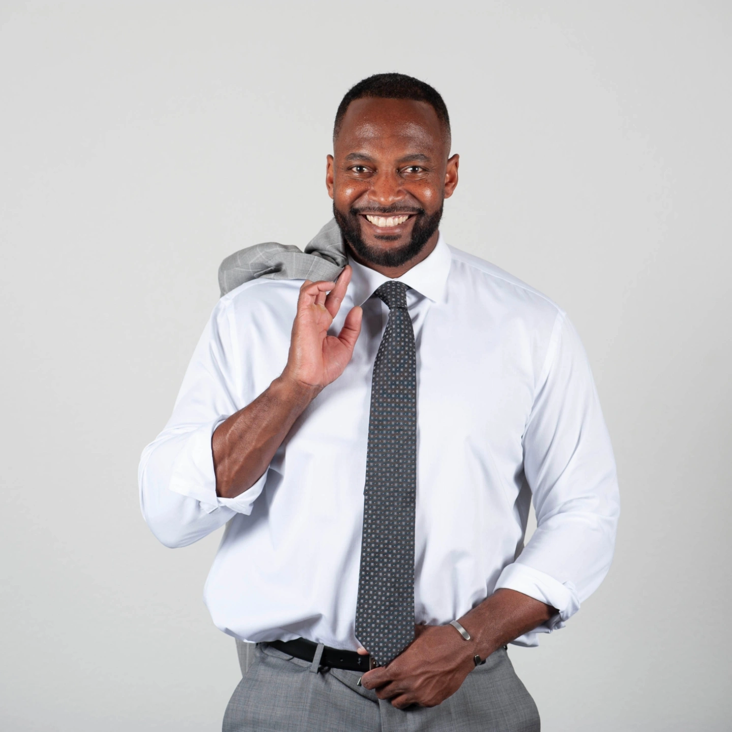 Carl Latting smiling in professional attire