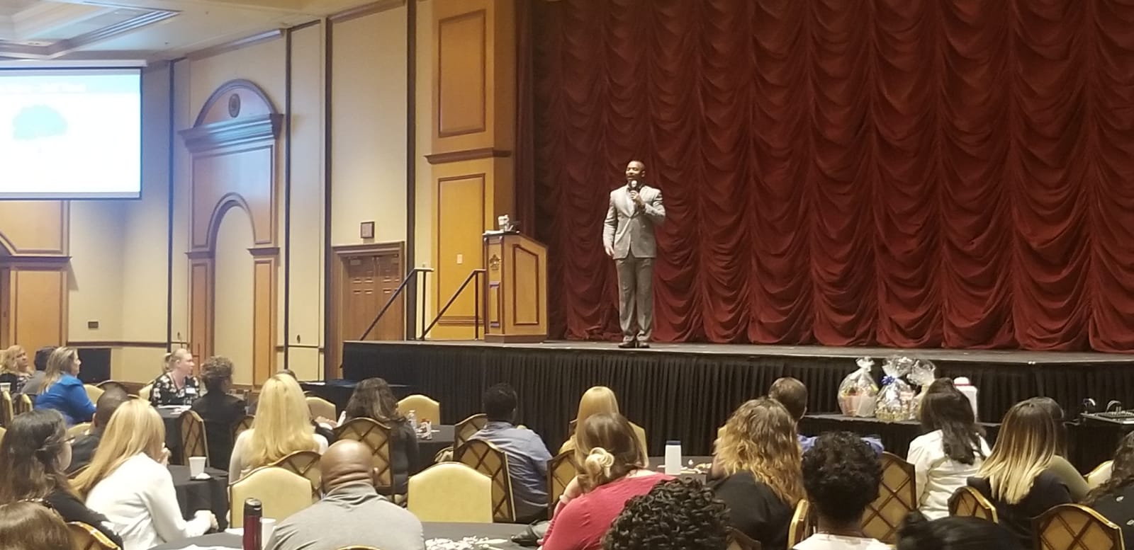 Carl D. Latting II speaking on stage