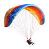 Person paragliding with a vibrant, multicolored parachute against a white background.