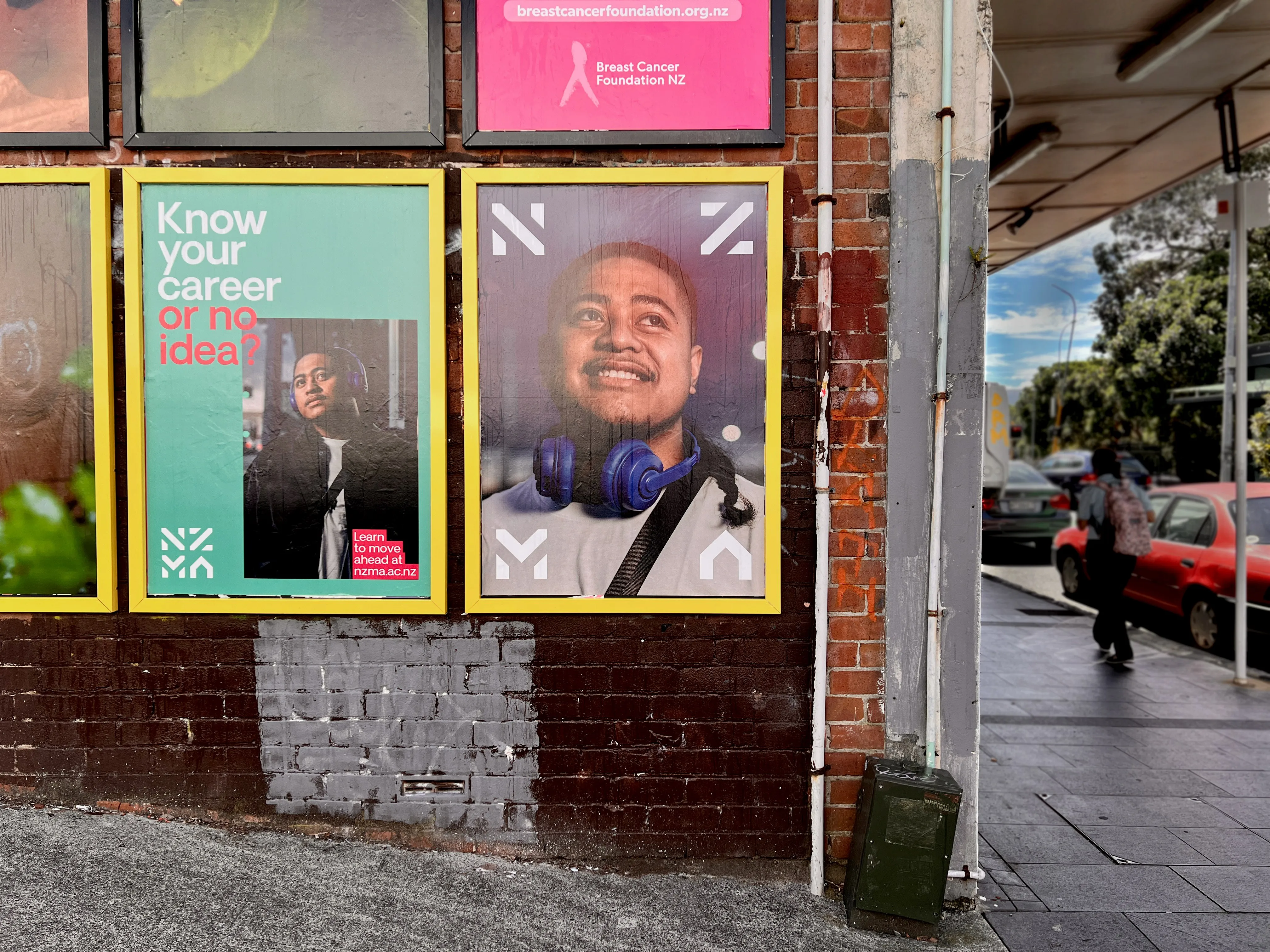 Two NZMA street posters side by side