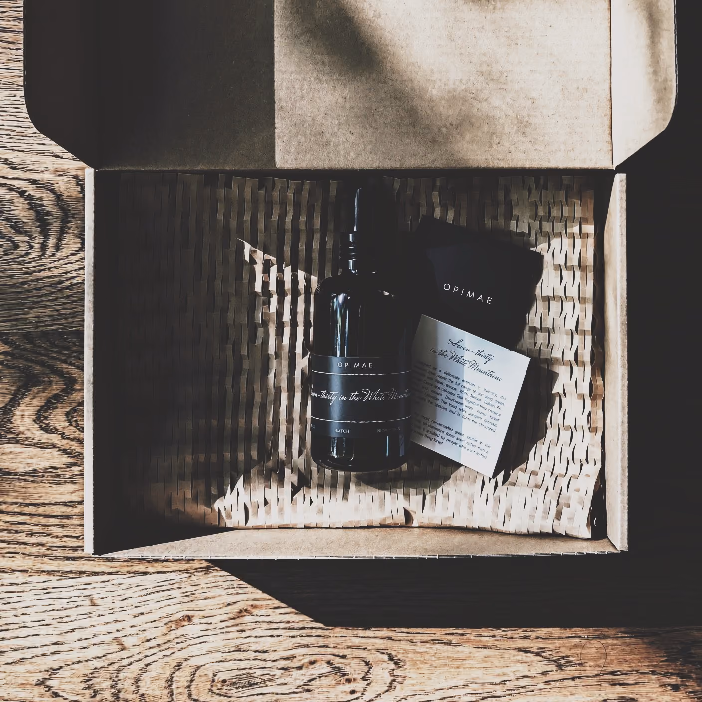 Bottle of Seven Thirty in the White Mountains room perfume in a box