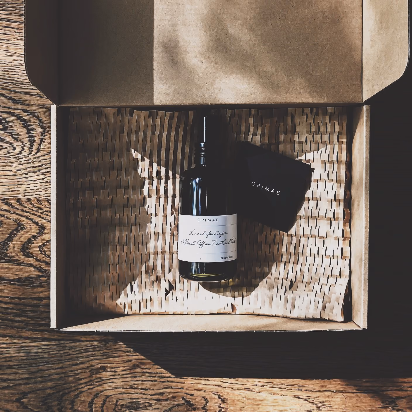 Bottle of A Breath Off an East Coast Trail room perfume in a box