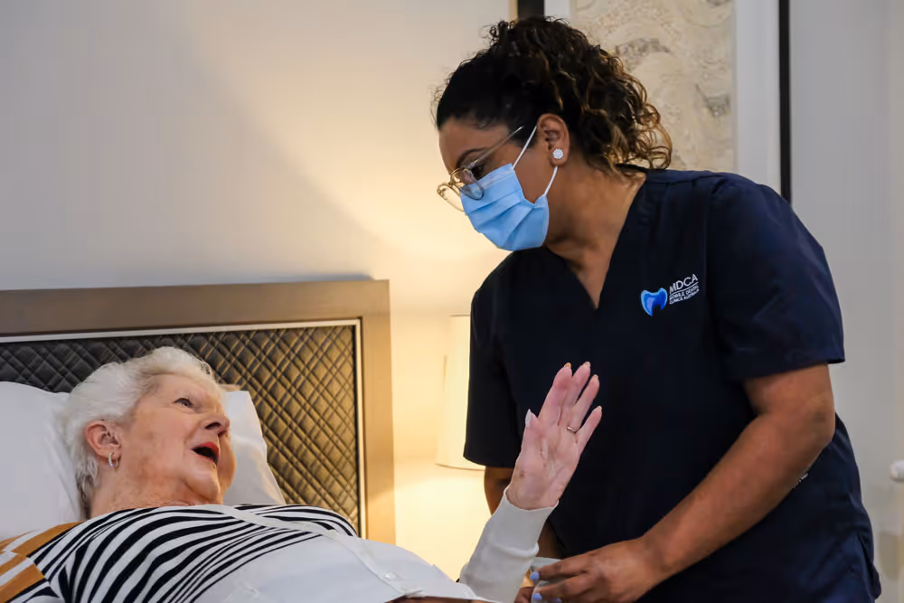 A mobile dental clinic Australia technician attending patient