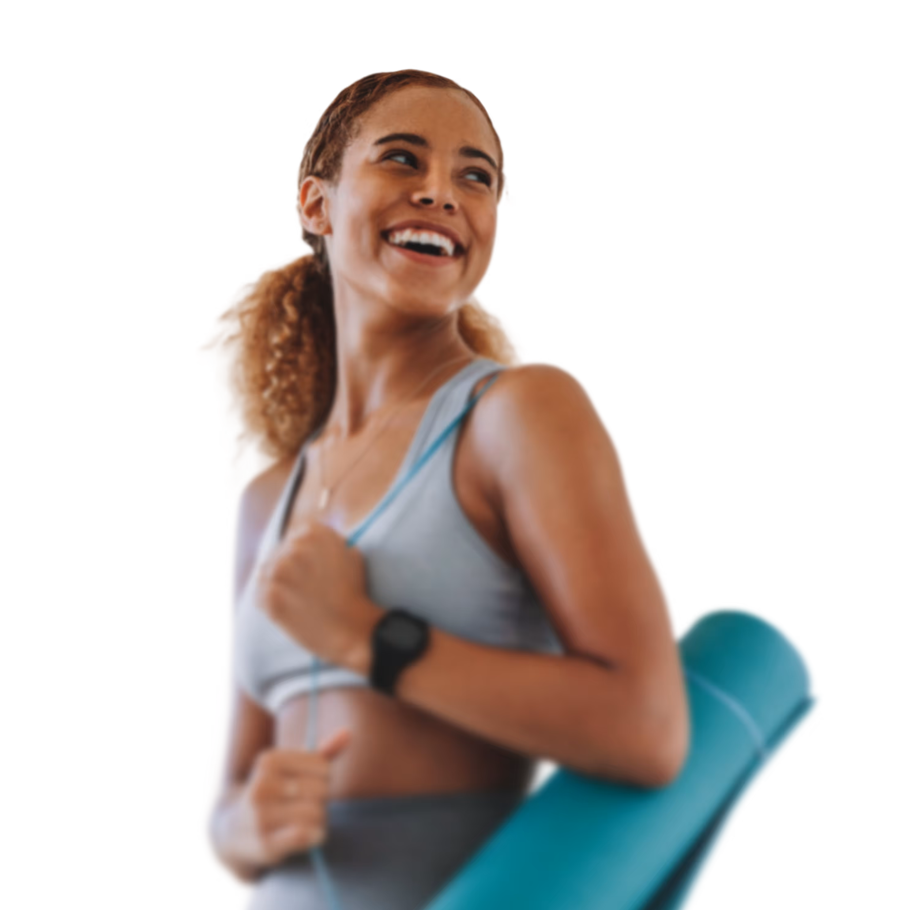 Smiling female runner holding a yoga mat during an outdoor workout, wearing athletic clothing and a fitness watch