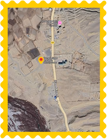 Satellite map showing Kaza Helipad and Snowlake Spiti along a road in a barren mountainous area.