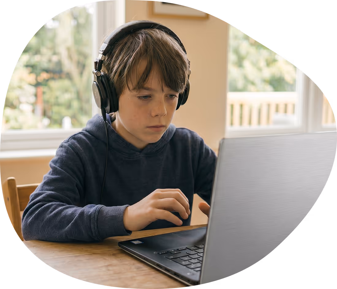Student with dyspraxia using a laptop for typing support