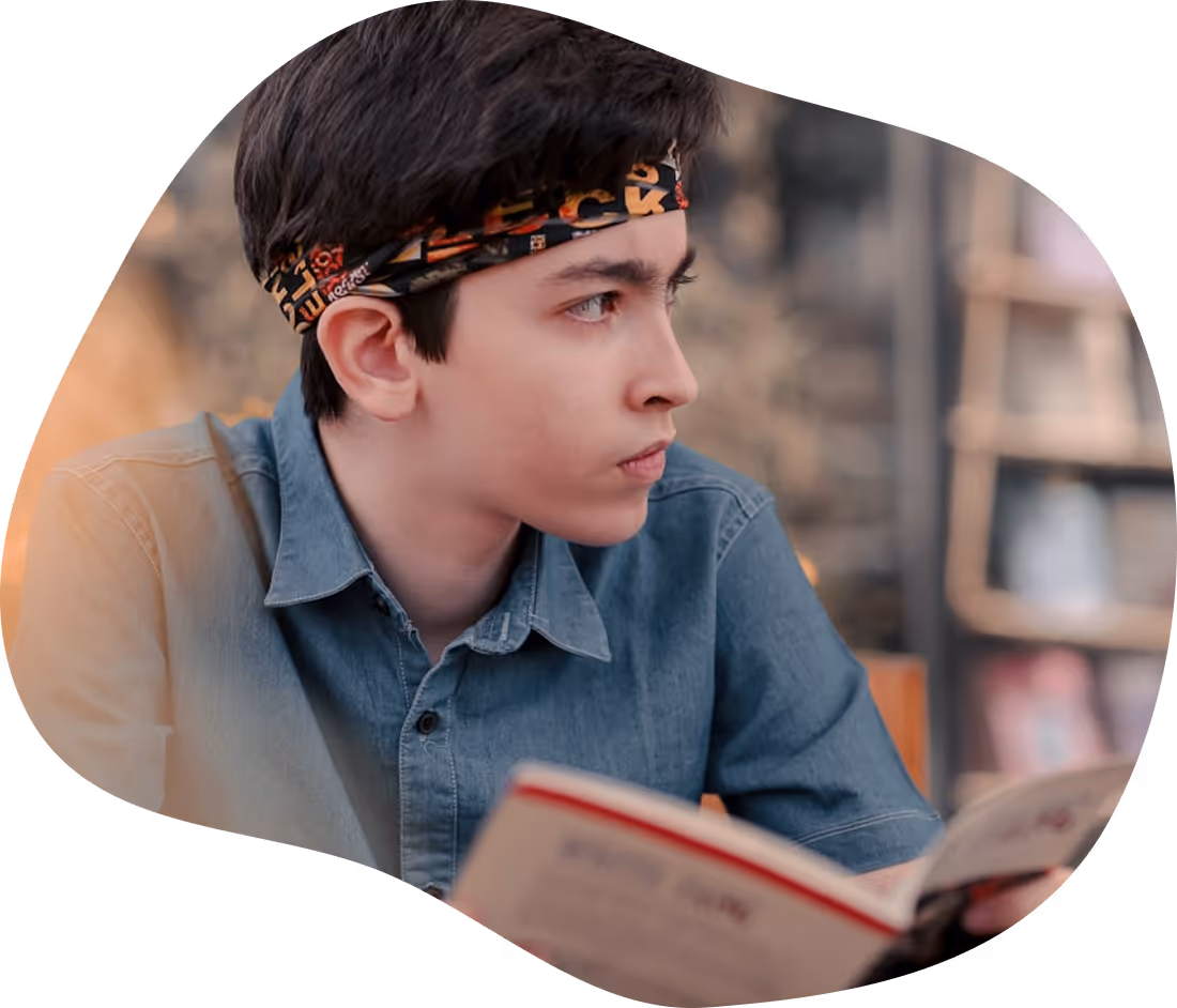 Student struggling with reading while holding a book