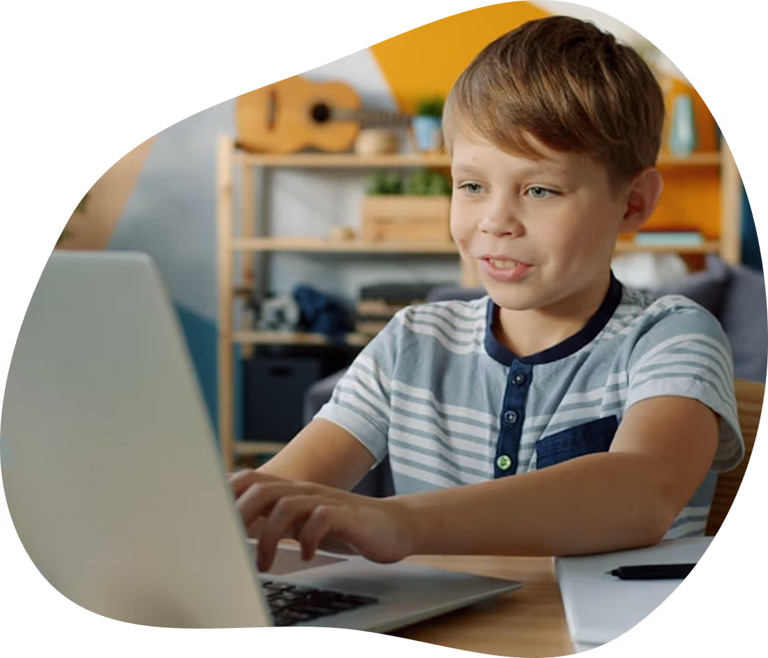 Child using a laptop to improve spelling and typing skills with Touch-type Read and Spell