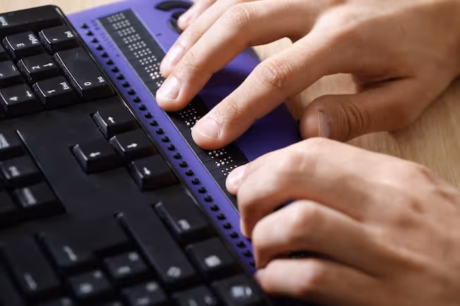 A Braille keyboard makes typing on a tablet easier
