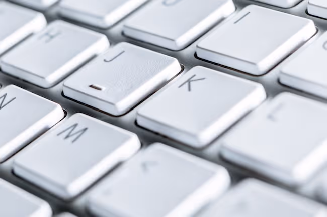 Run your fingers along the raised F and J keys to find the basic hand position