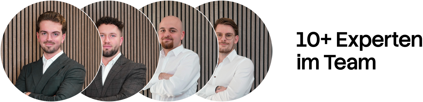Four professionals in business attire posing with arms crossed against a vertical wooden slat background.