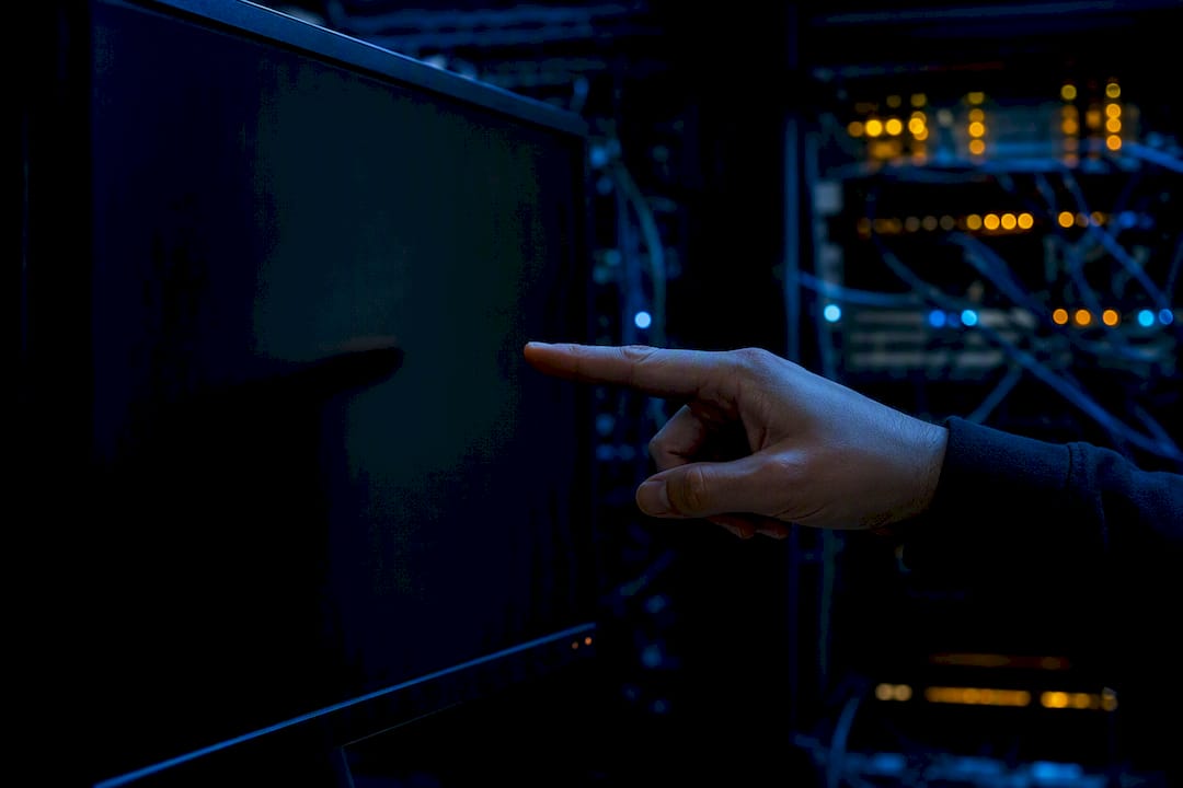 Hand pointing at network monitoring area