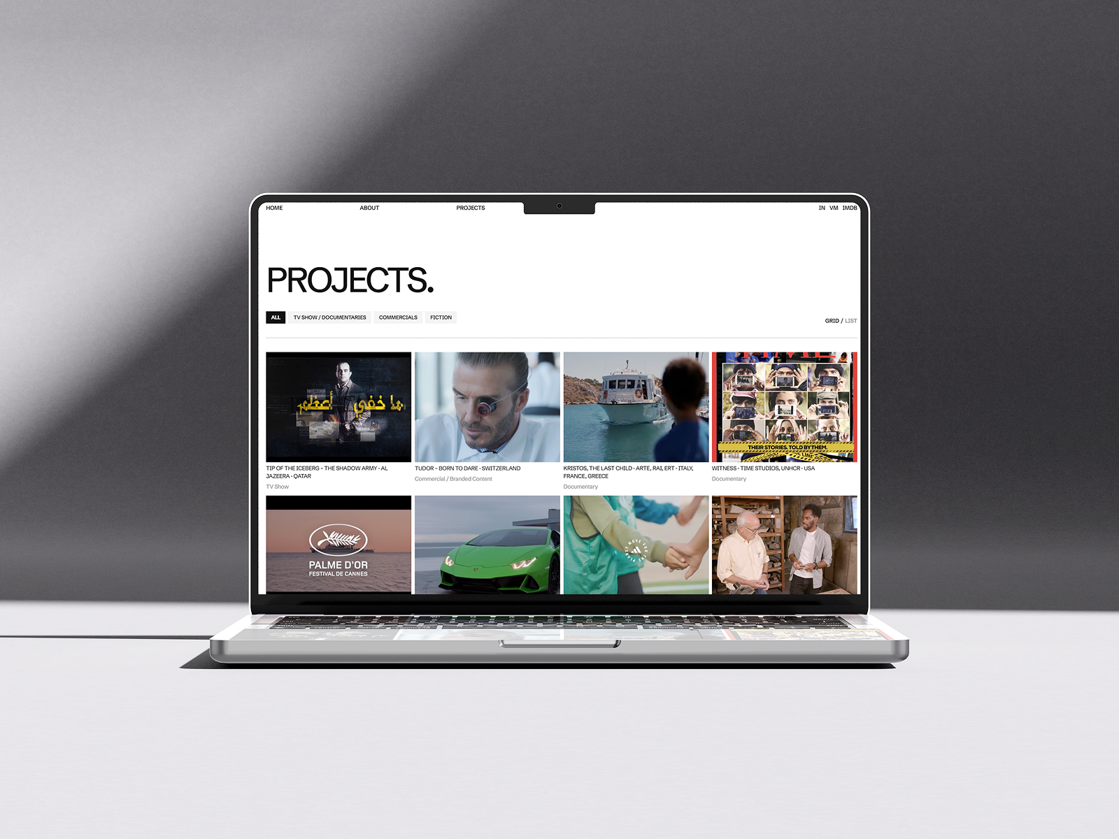 Manolis Makridakis website mockup in laptop. Projects page preview
