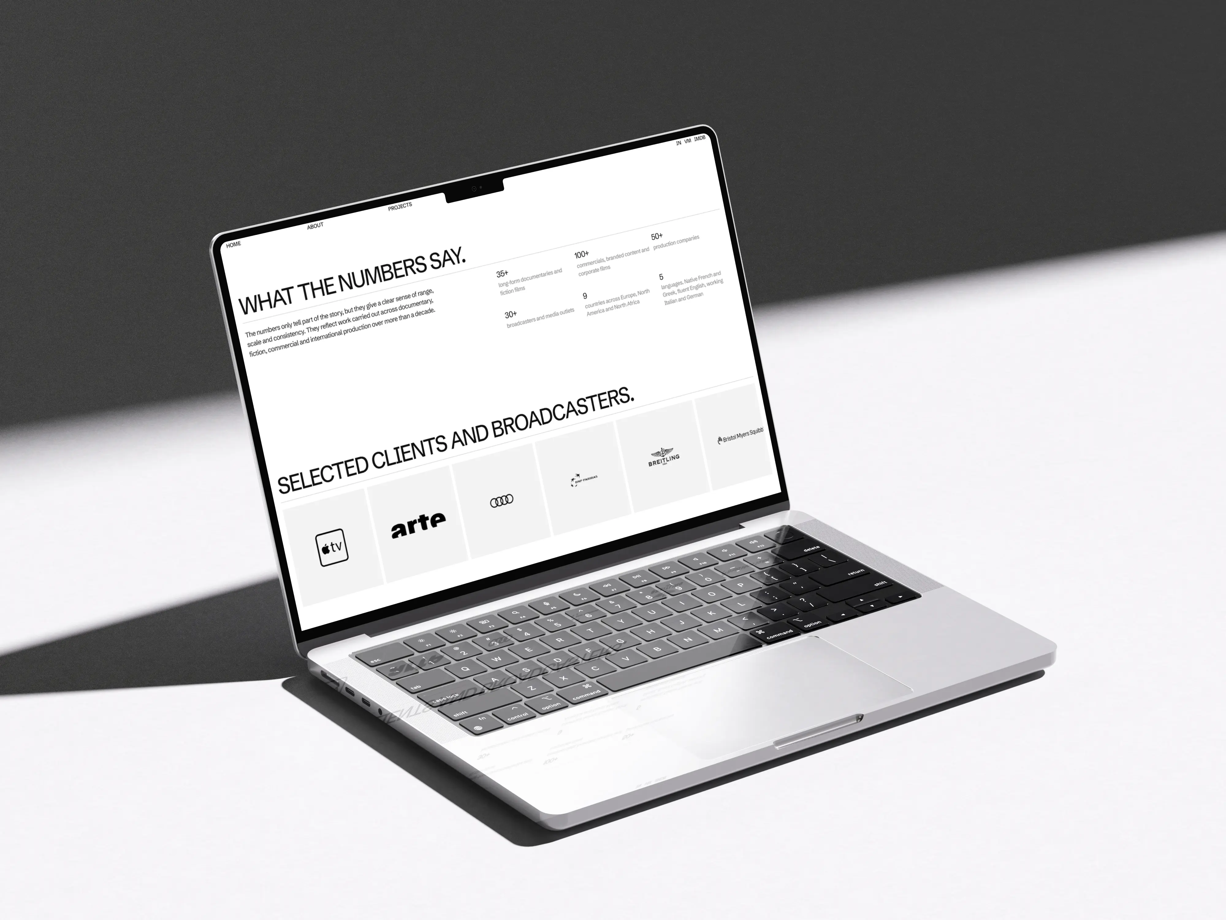Manolis Makridakis website mockup in laptop. Showing the about page.