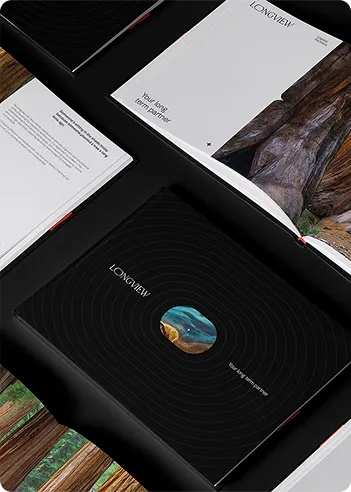 Open and closed Longview brochures with nature photos and text 'Your long-term partner' on black and white pages.