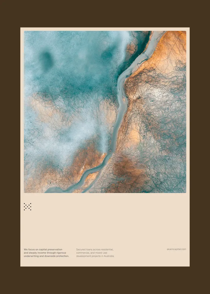 Abstract aerial view with blue and orange hues separated by a winding river or channel.