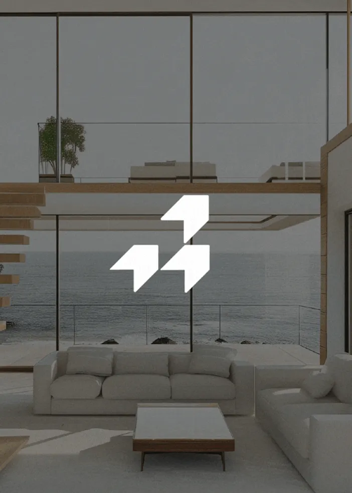 Modern living room with light sofas, a wooden coffee table, and large windows overlooking the ocean.