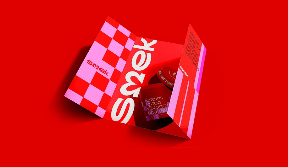 Open red and pink Smek product box with checkered design on a red background.