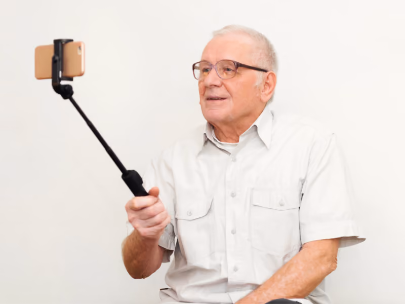 Senior man making a video eulogy to be played at his funeral or memorial.