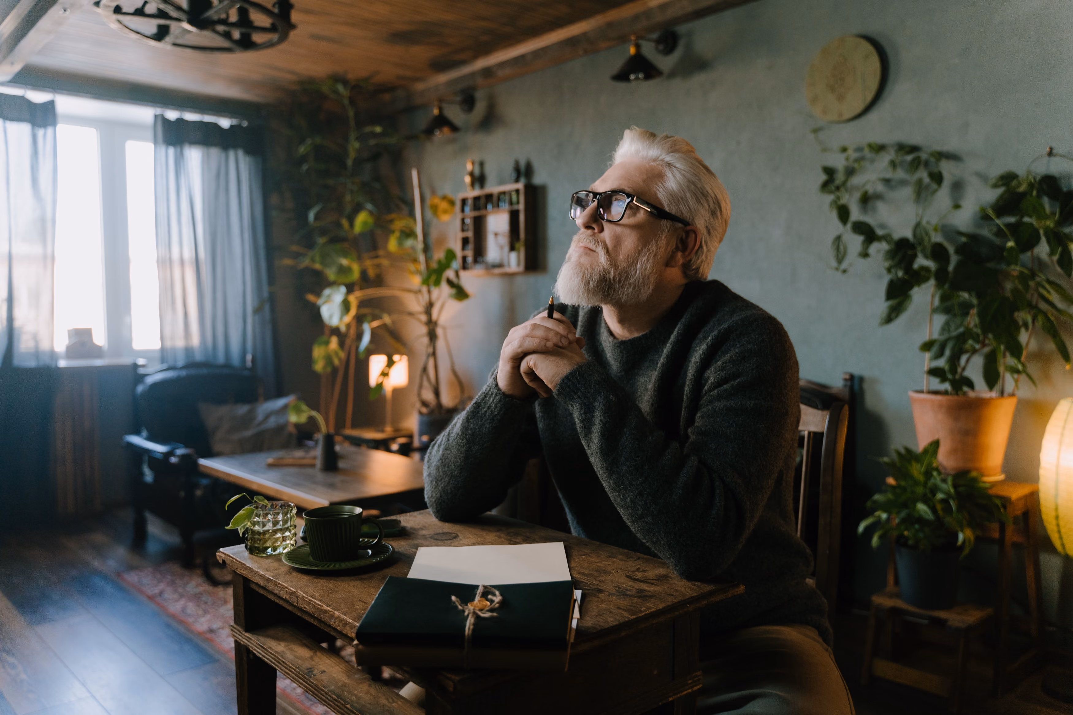 Elderly man writing his life story