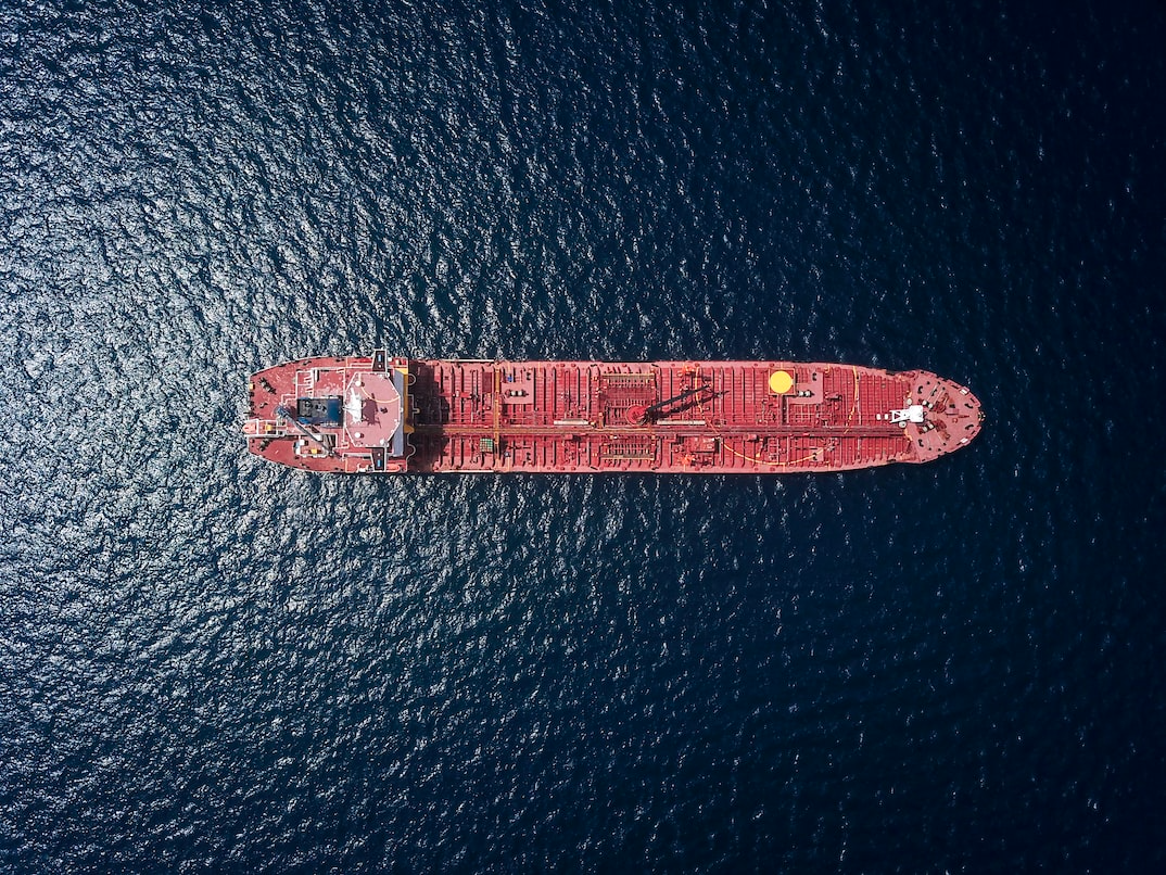 Aerial view of tanker on calm waters.