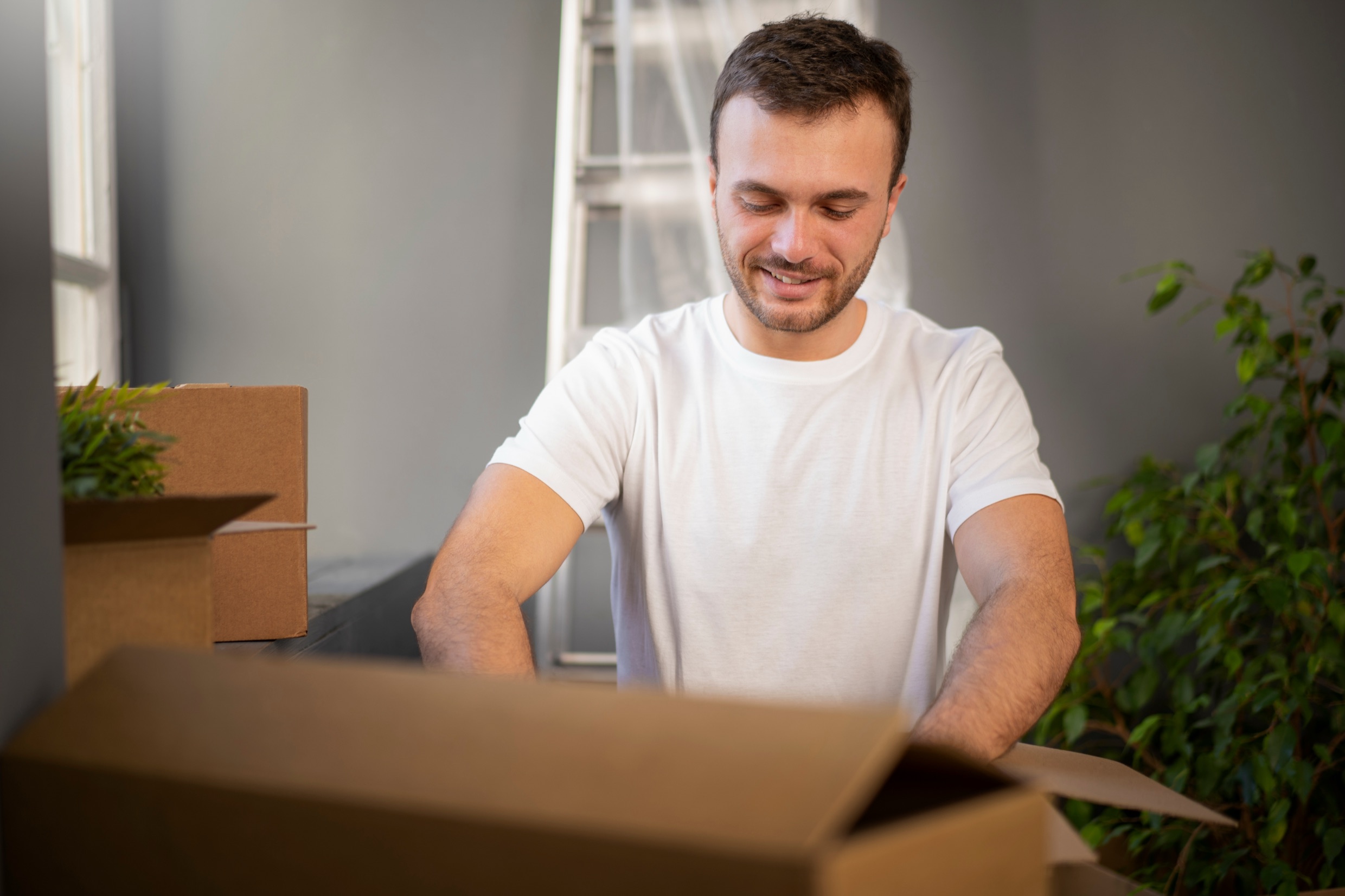 Small business owner reviewing fulfilment orders on a laptop