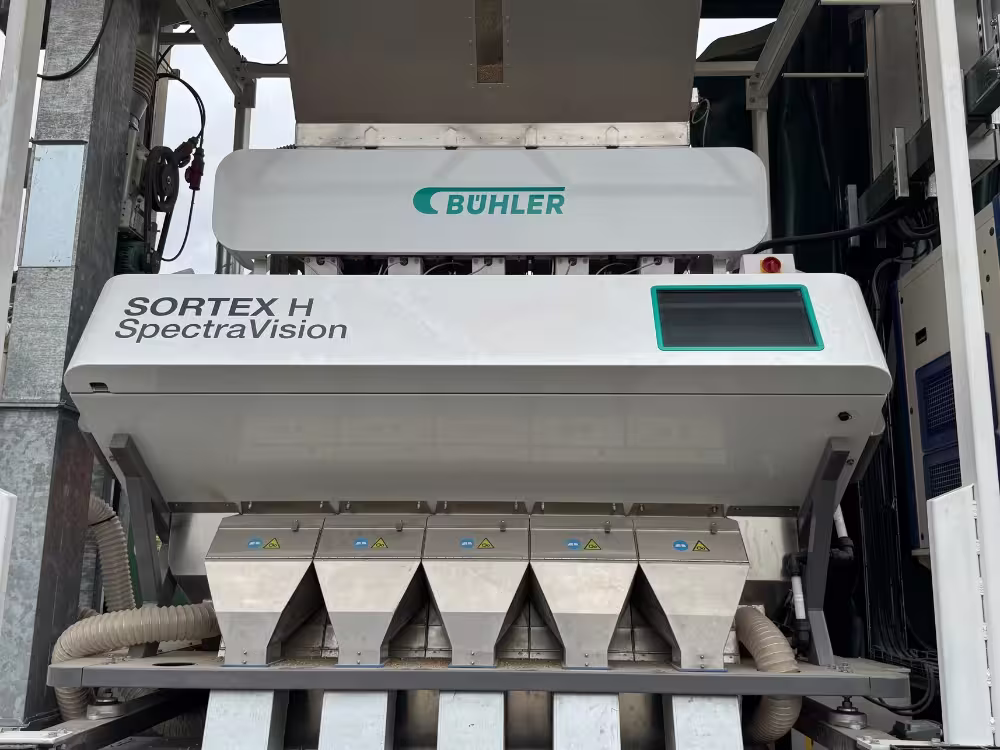 Buhler SORTEX H SpectraVision optical color sorter machine with multiple metal chutes and a display screen.