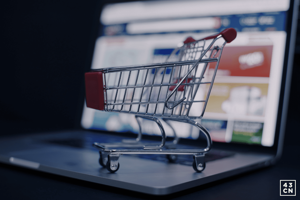 shopping-cart-figure-sitting-on-laptop-keyboard