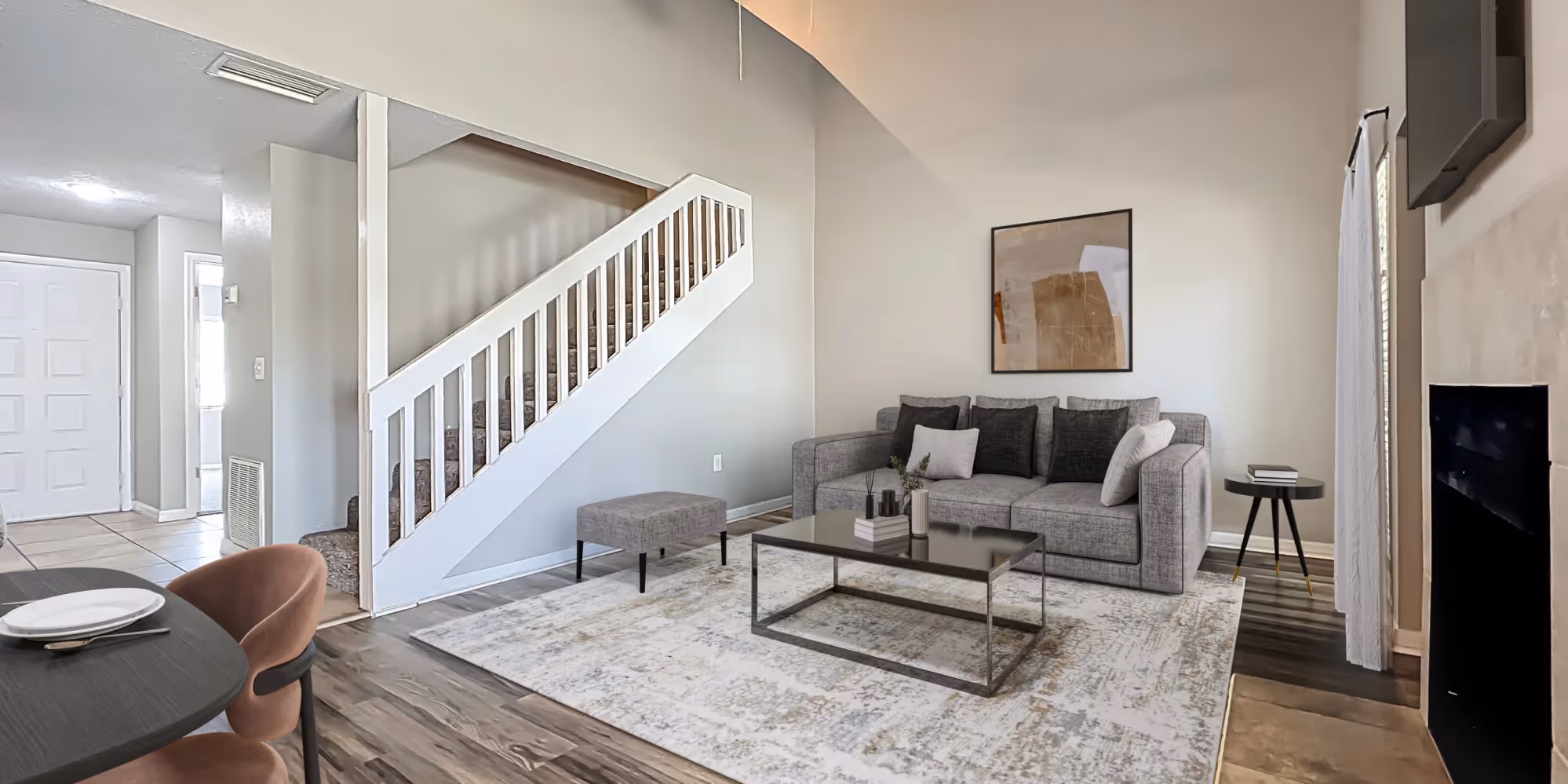 View of Living area with virtual staged furniture including tv, coffee table, and sofa