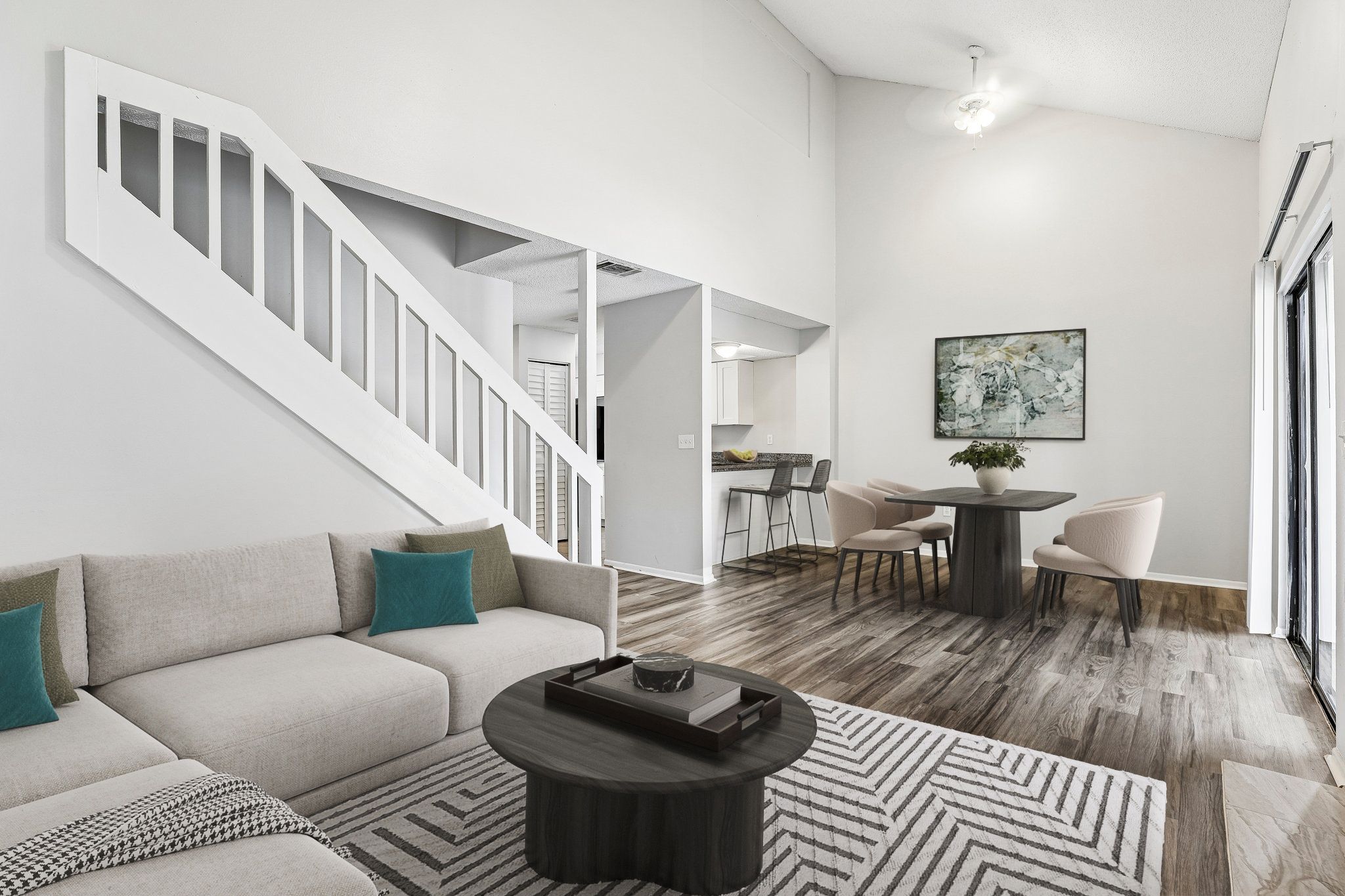 View of Living area with virtual staged furniture including tv, coffee table, and sofa