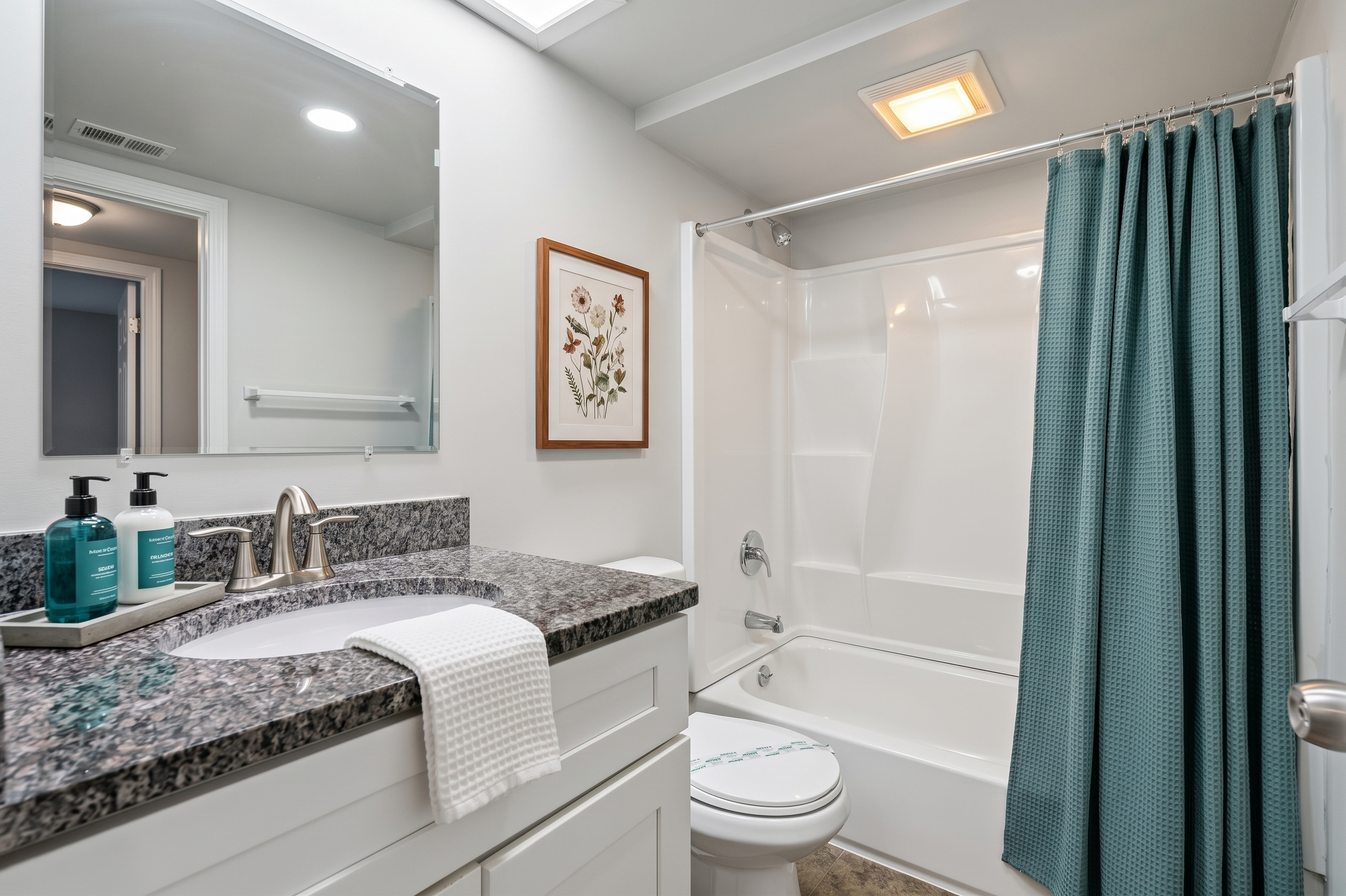 bathroom with shower curtain and towels