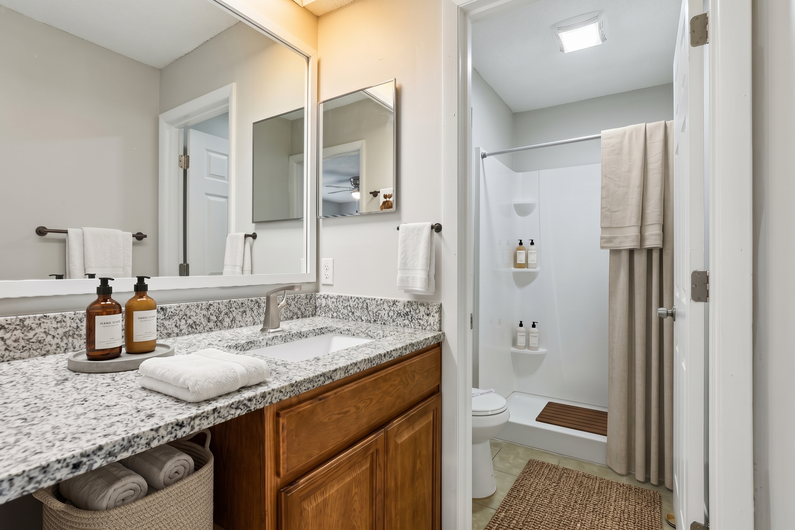Bathroom with shower curtain and towels.