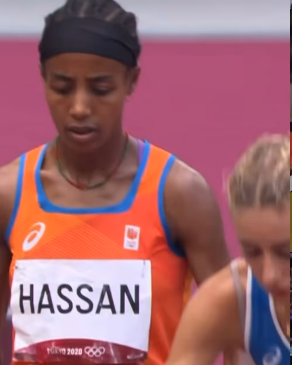 Athlete Hassan wearing an orange and blue running uniform at Tokyo 2020 Olympics.
