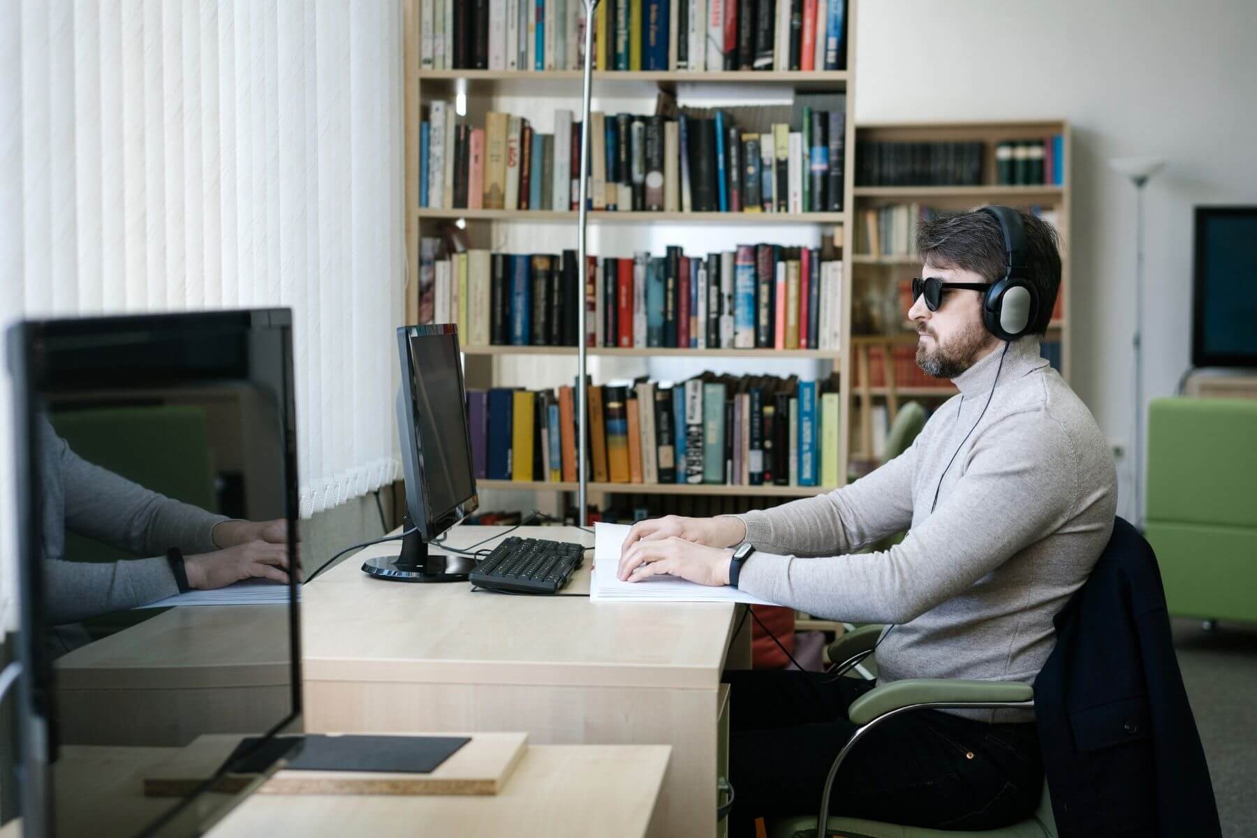 visually impaired man working at the office