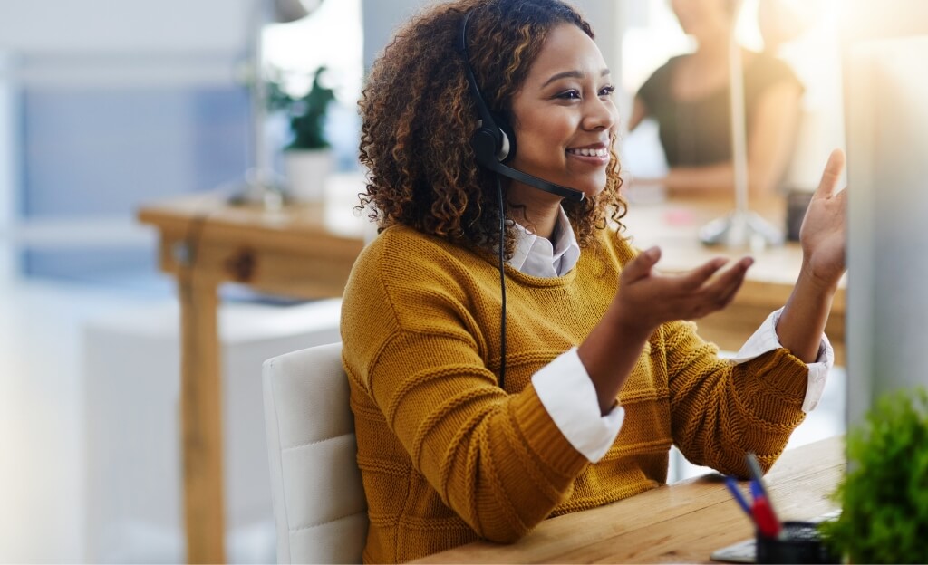 woman talking on headphones at the office