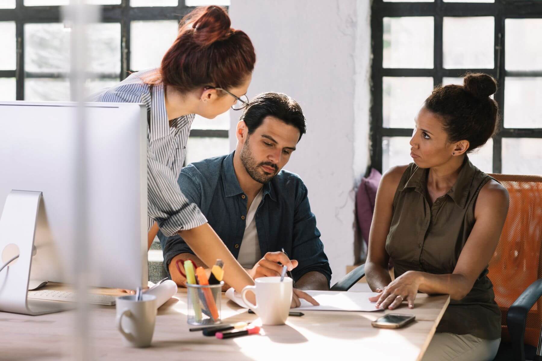 team holds a discussion at the office 